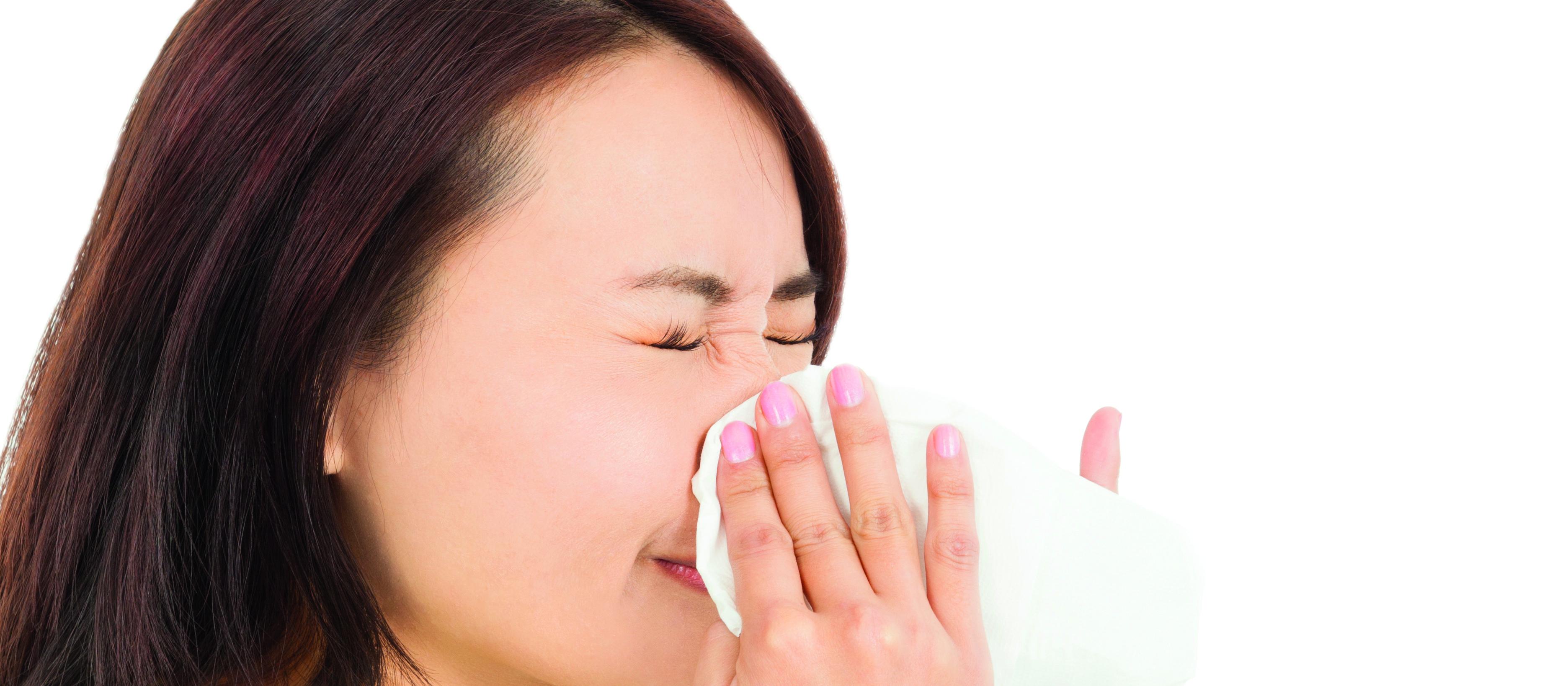 Woman sneezing