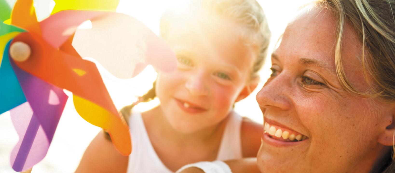 Mother and daughter in sunlight