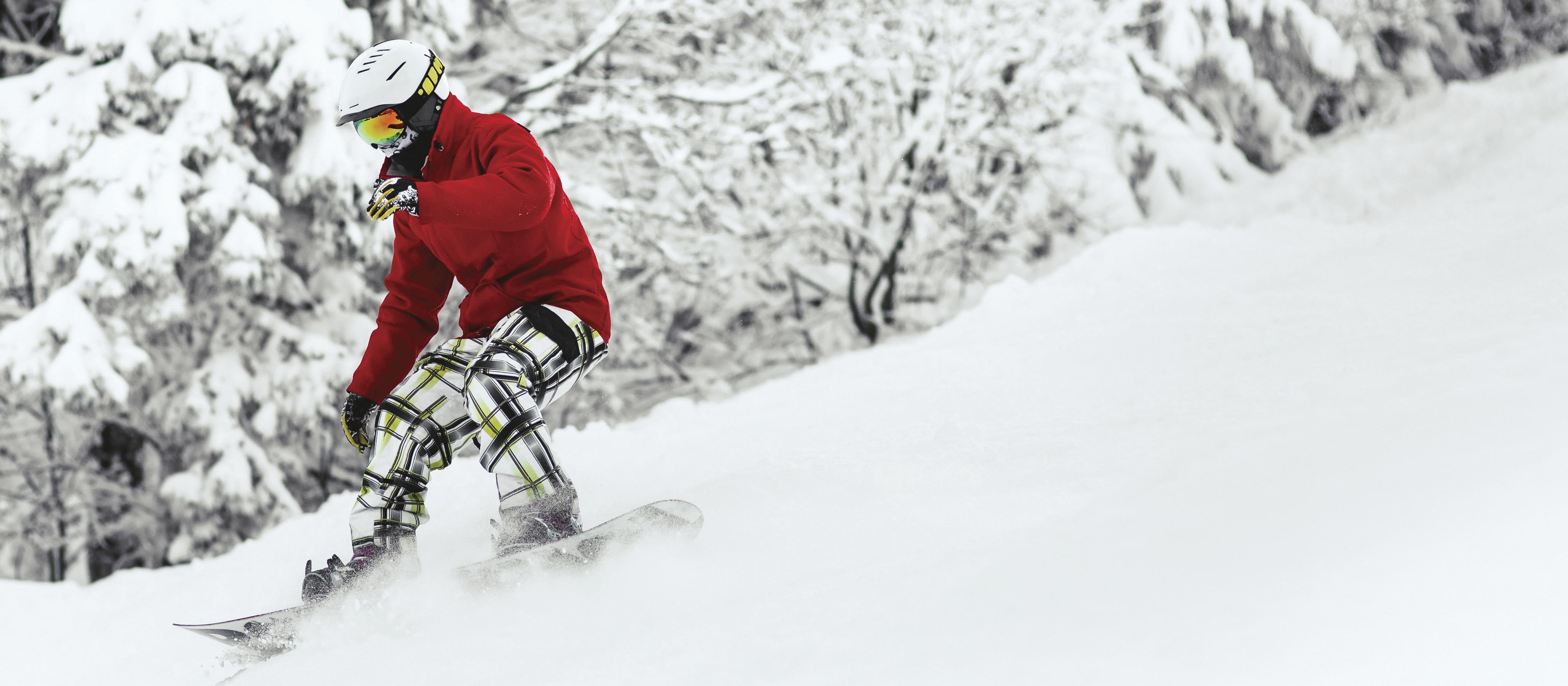 Snowboarding down a slop