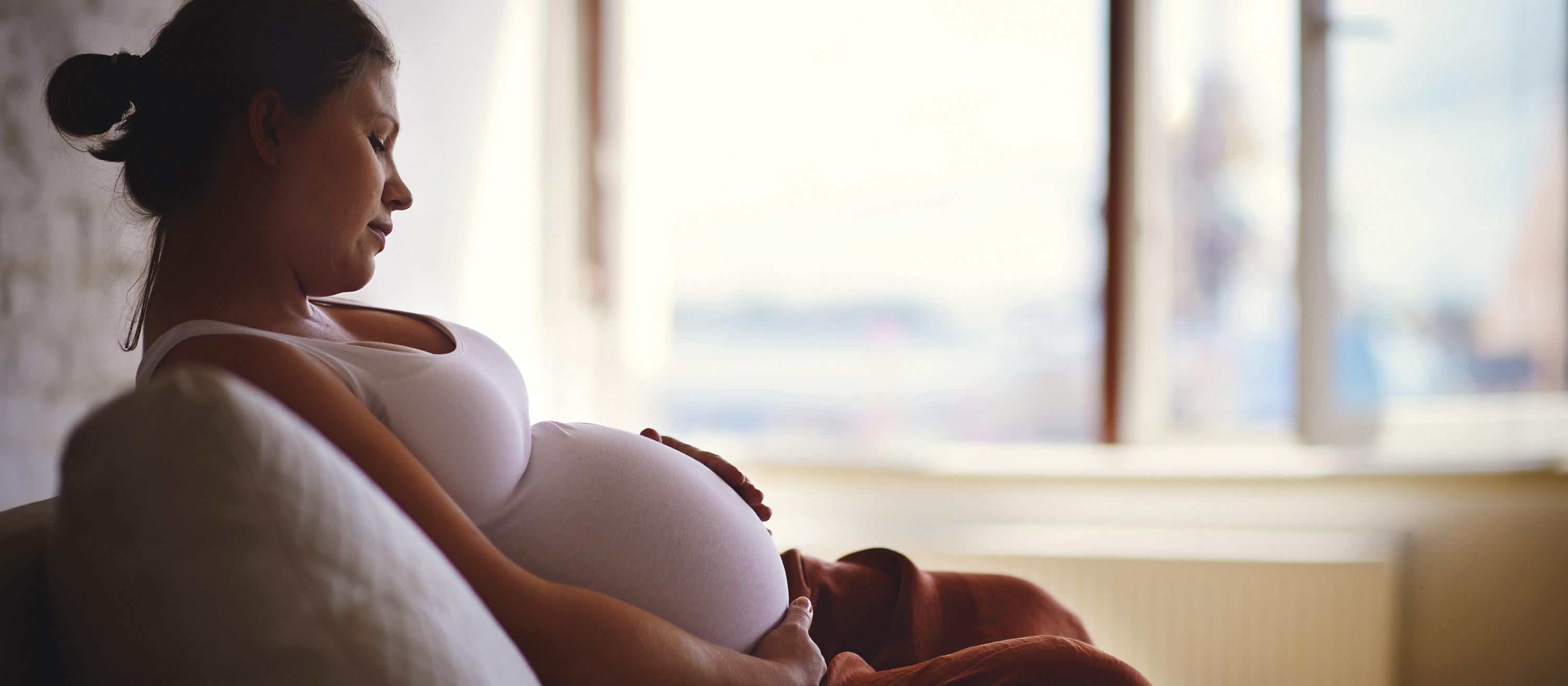 Pregnant woman on couch