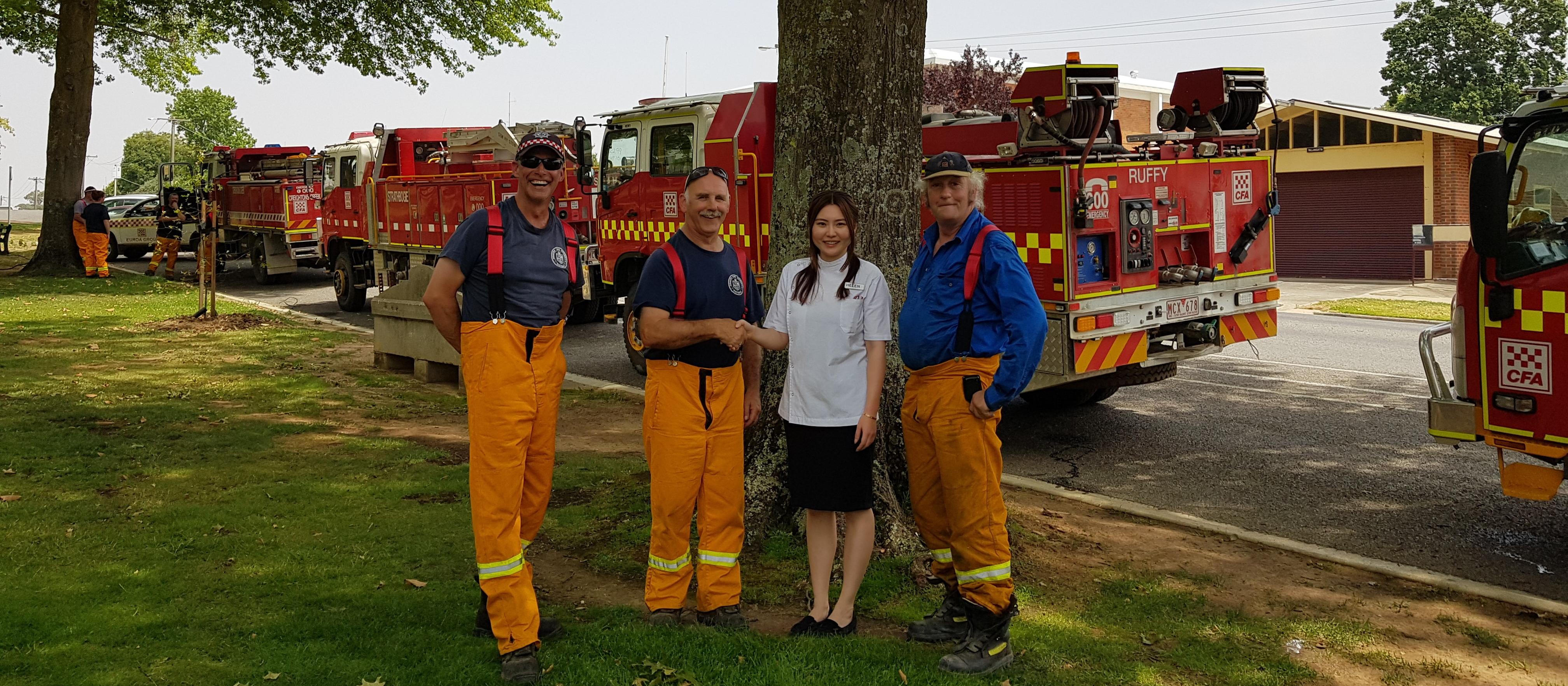 Helen Feng, owner Alliance Pharmacy - Tallangatta, with local CFA crew 