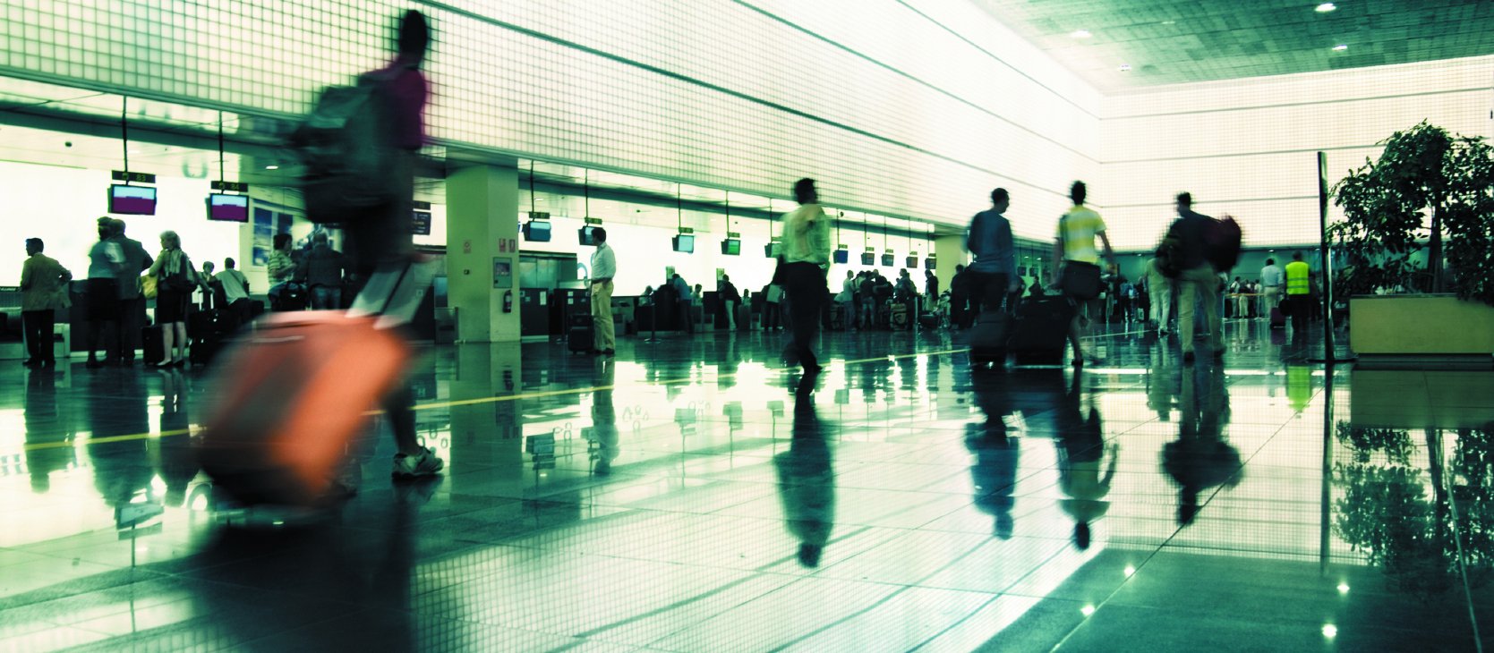 Travellers in busy airport