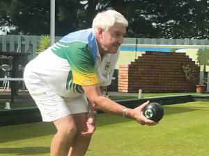 Warren Flaunty holding lawn bowl