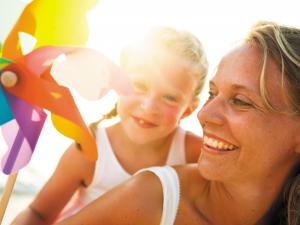 Mother and daughter in sunlight