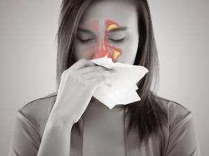 Woman sneezing