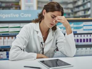 Stressed with headache pharmacist 