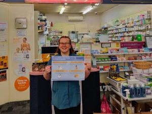 Dunedin City Pharmacy pharmacy assistant Aelyth Harrison with ISoP poster