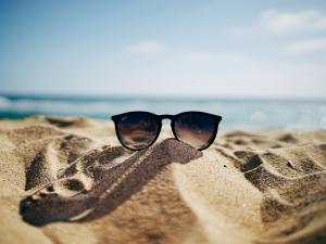 Summer, sand, beach, sunglasses [image: Ethan Robertson Unsplash]