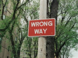 Wrong way sign CR Randy Laybourne on Unsplash